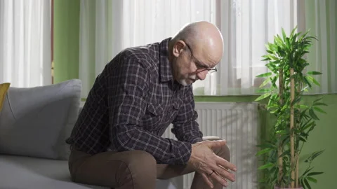 Lonely old man inside sitting alone at home. Thoughtful retired man. Stock-Footage 232238866