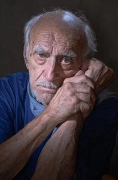 A lonely old man. Stock Photos