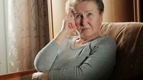 Lonely pensive elderly woman thinking about problems Stock-Footage 123728540