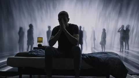 Lonely Person Sitting On Bed With Ghostly Figures Mental Health Depression Stock Footage 288880350