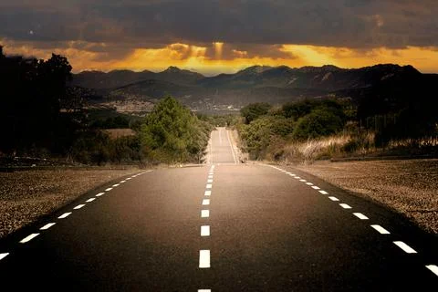 Lonely road with elevation changes. Stock Photos