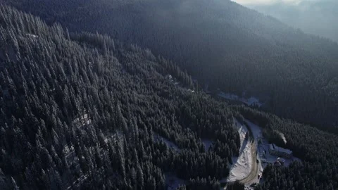 Lonely road in the mountains during winter Stock Footage 328412073