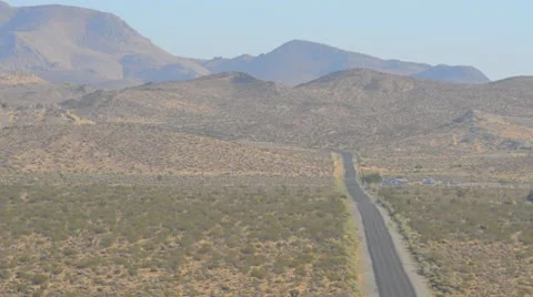 Lonely road through desert Stock Footage 9543203
