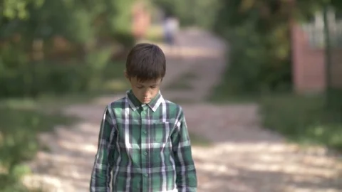 lonely sad boy walking along the Stock Video Pond5