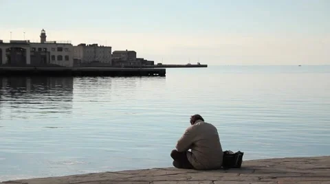 Lonely sad man by the seaside Stock Footage 47175764