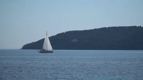 Lonely sailing ship on the horizon Stock Footage 75004885