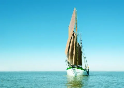 Lonely sailing ship Stock Photos
