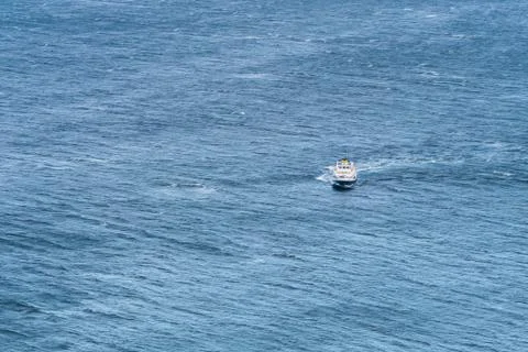 Lonely ship in the ocean. Stock Photos