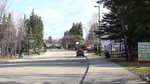 Lonely small town street during an afternoon - Pan Stock Footage 146616632