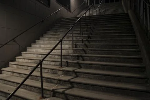 Lonely Staircase at Night with Dramatic Shadows and Mysterious Atmosphere Stock Photos
