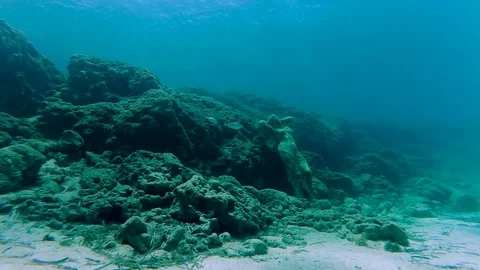 A lonely statue on the bottom of the sea Stock Footage 76461199