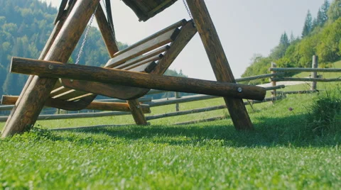 Lonely swing on a green grass Stock Footage 59099132