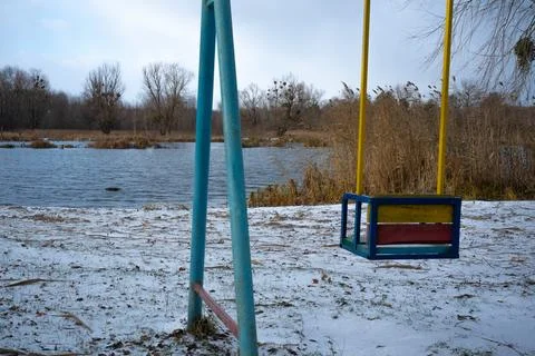 Lonely Swing Set by the Lake Stock Photos