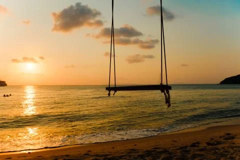 Lonely swing sunset Stock Photos