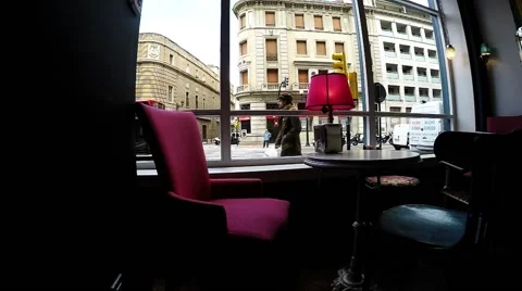 Lonely table in cafe with big window and city traffic Stock Footage 48469543