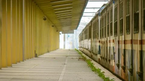 Lonely train station platform symbolizing journeys and moments of waiting Stock Photos