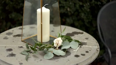 Lonely White Rose on Stone Table with Candle Decor Stock Footage 149708798
