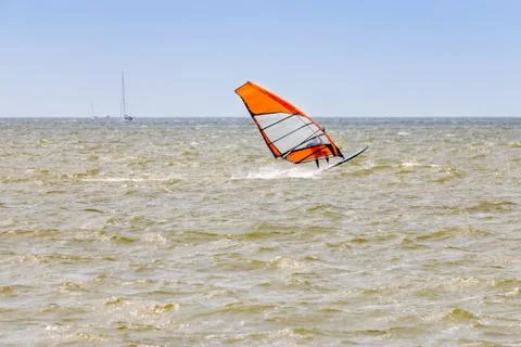 A lonely windsurfer in a strong wind Stock-Fotos