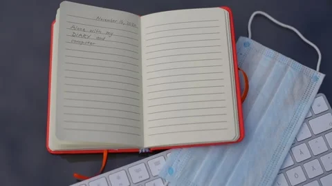 Lonely writer with a diary in corona-time Video stock 142013301