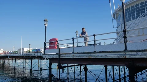 Lonely young man on a pier thinking about life Video stock 97071666