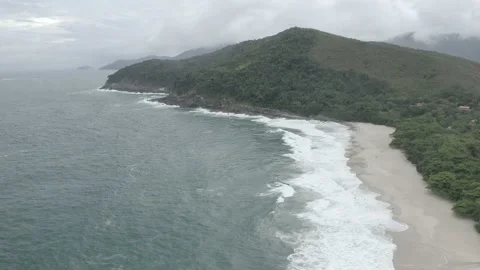 Long aerial drone time tracking surf in tropical beach wave BR UBA DJI 0751 B Stock Footage 140188441