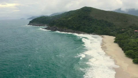 Long aerial drone time tracking surf in tropical beach wave BR UBA 0751 B GR Stock Footage 143286304