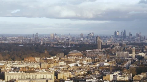Long aerial establishing shot of Kensington, London cityscape on a cloudy day Stock Footage