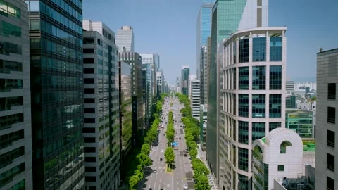 Long Aerial Take Flying Backward Between Skyscrapers to Reveal Gangnam Skyline Stock Footage 345212307
