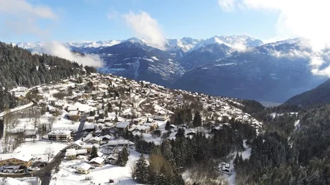 Long aproach, Ovronnaz in winter - Aerial 4K Stock Footage 124220153
