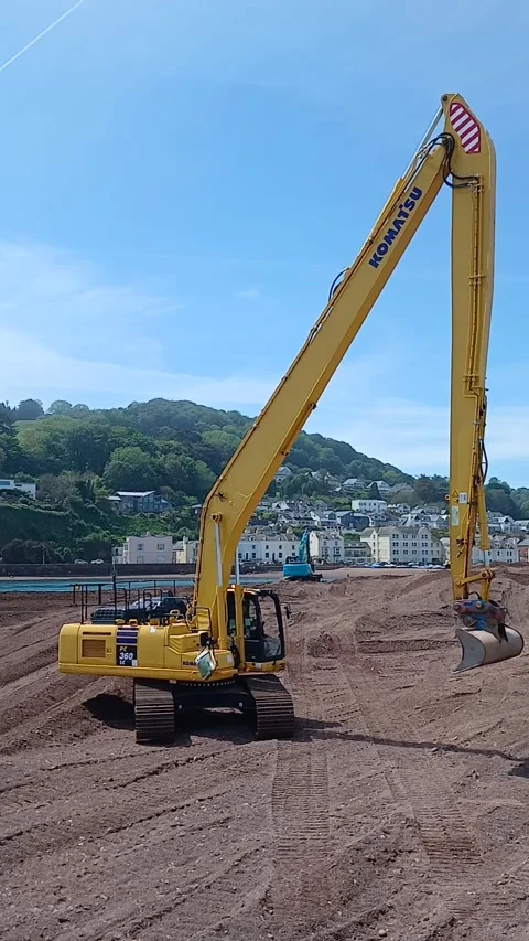 A long arm excavator used to move sand at The Point, Teignmouth, Devon, England. Stock Footage 335414685