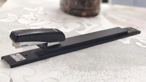 Long Arm Stapler on Office Table Stock Photos