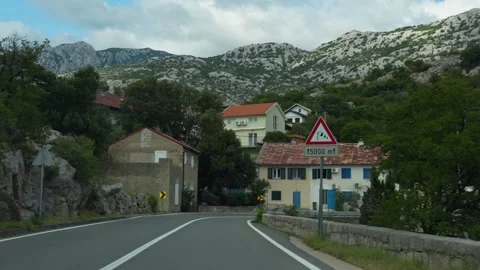 Long asphalt road winding through a picturesque Croatian mountain Stock Footage 299895533