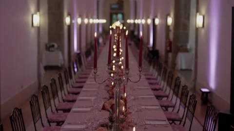 Long Banquet Table With Candelabras And Red Candles In A Grand Hall 動画素材 343806432