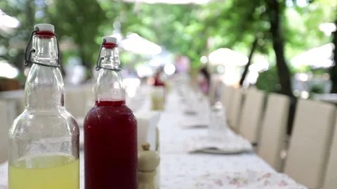 Long banquet table in the open summer area Stock Footage 245587465