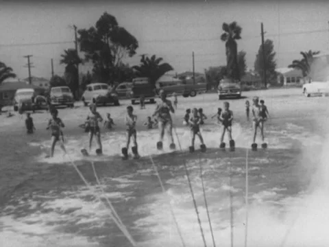 Long Beach, CA - 8/24/54: Children perform tricks on waterskis Stock-Footage 234550110