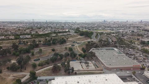 Long Beach wide panorama with large warehouse rooftops, parking lots, dense Stock-Footage 335901868