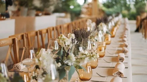 Long Beige Dinner Table Served With Delicious Dishes. Video stock 112141298