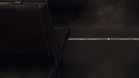 Long bench seat in empty train car during late evening hours Stock Footage 340998173