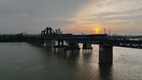 Long Bien Bridge and Train Crossing the Red River at Sunset in Hanoi, Vietnam Stock Footage 344742276