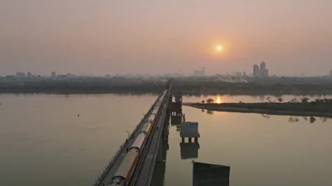 Long Bien Bridge over the Red River at Hazy Sunrise in Hanoi, Vietnam Stock Footage 344741493