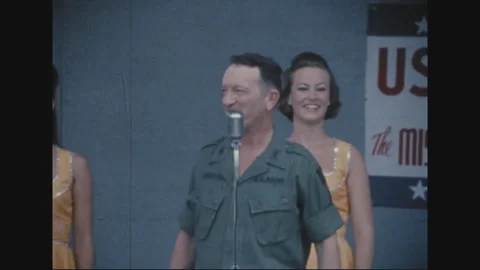 LONG BINH, VIETNAM - 1969: the comic bit continues beneath the banner Stock Footage 341323939