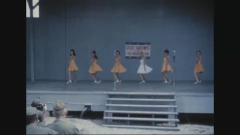 LONG BINH, VIETNAM - 1969: the dance line works beneath the USO banner Stock Footage 341323918
