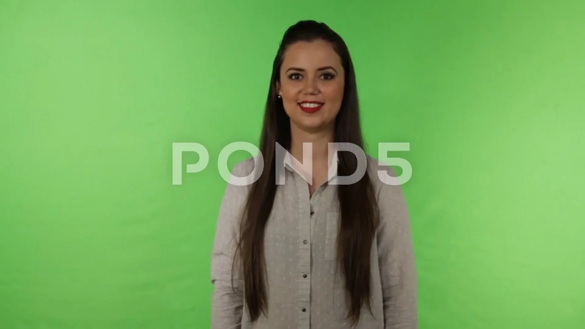 Long black hair Latina woman smiling on green screen