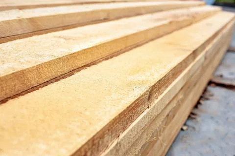 Long boards for construction work piled on each other. Building material Stock Photos