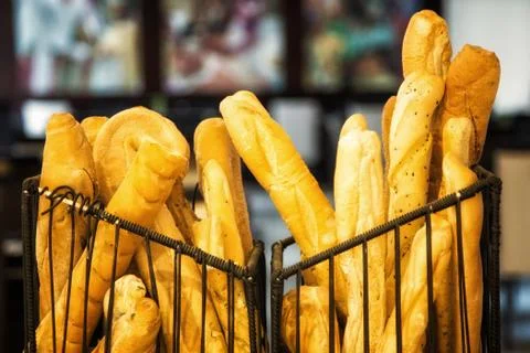 Long breads on baskets Stock Photos