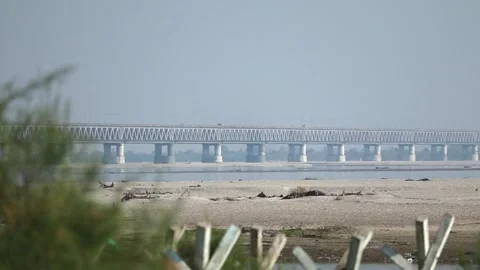 Long bridge across river with sandy foreground Stock Footage 331277550