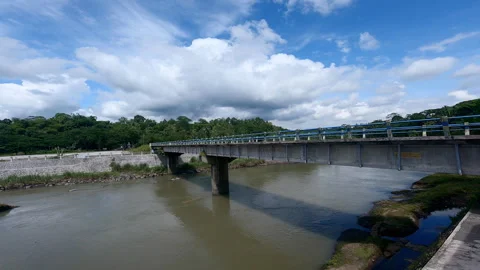 Long bridge of big river panning shot Stock Footage 240217131