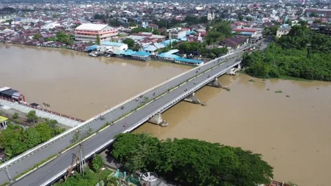 The long bridge connecting Teluk Dalam and Pekauman Banjarmasin which is bu.. Stock Footage 318079405