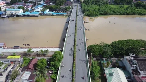 The long bridge connecting Teluk Dalam and Pekauman Banjarmasin which is bu.. Stock Footage 318079559