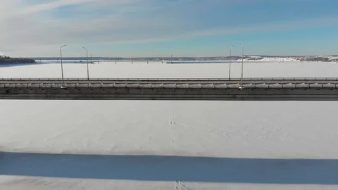 Long bridge over the frozen river Stock Footage 101577178